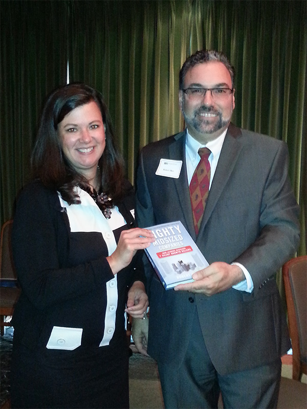 Robert Sher presenting his book to our drawing winner, Kimberly Crosslin.